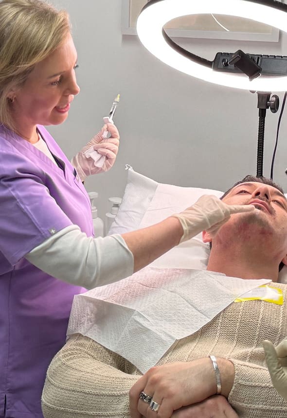 Lower Face Contouring Masterclass: a trainer teaches contouring techniques during the in-person training course.